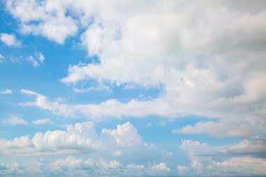 Blue sky background with clouds. Beauty clear cloudy sunshine calm bright texture. Vivid cyan landscape in spring day environment