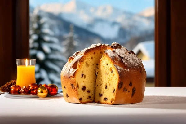 Panettone. Italian Culinary Tradition. Christmas sweet bread made with yeast, butter, eggs, and candied fruit. Served in a elegant restaurant in montain in winter with in the background, a window with