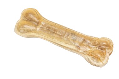 Beyaz izole arka plandaki köpekler için yapay çiğneme kemiği. Üst Manzara. Evcil hayvan ya da hayvan konsepti.
