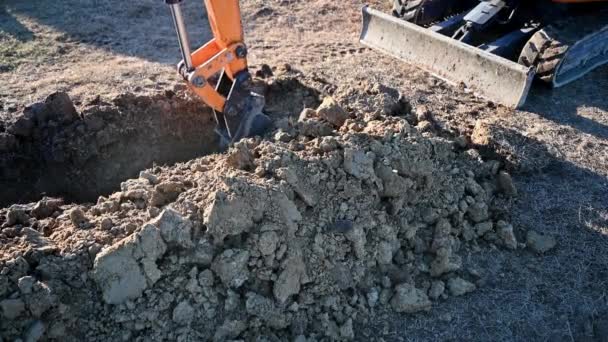 Close Bucket Excavator Digging Soil Construction Site — Stockvideo