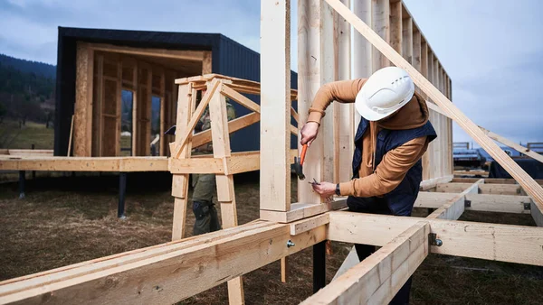 Man Worker Building Wooden Frame House Pile Foundation Carpenter Hammering — Stockfoto