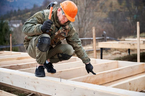 Man Worker Building Wooden Frame House Pile Foundation Carpenter Hammering — Foto Stock