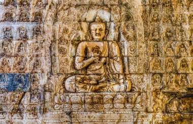 Buddha Carving Cloud Platform Great Wall Juyongguan Juyong Pass Beijing China. Juyongguan northern gateway to Beijing and closest Wall to Beijing. Cloud Platform Buddhist Temple built 1342 and 1345. Platform has many Buddhist carvings.  clipart