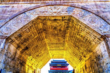 Cloud Platform Arch South Gate Great Wall Juyongguan Beijing China. Arch has Buddhist decorations Closest gateway to Beijing. Built 1300s. Big Gate Chinese Characters mean most Glorious Gate Under Heaven. clipart