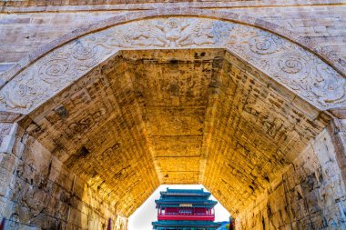 Cloud Platform Arch South Gate Great Wall Juyongguan Beijing China. Arch has Buddhist decorations Closest gateway to Beijing. Built 1300s. Big Gate Chinese Characters mean most Glorious Gate Under Heaven. clipart