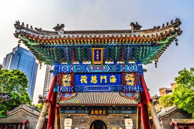 Tianjin, China - October 8, 2024 Main Entrance Gate Tianhou Queen of Heaven Taoist Temple Cultural Street Tianjin China.  Temple for Sea Goddess Mazu to pray for safety of navigation. Temple first created 1326 in Yuan Dynasty.  clipart