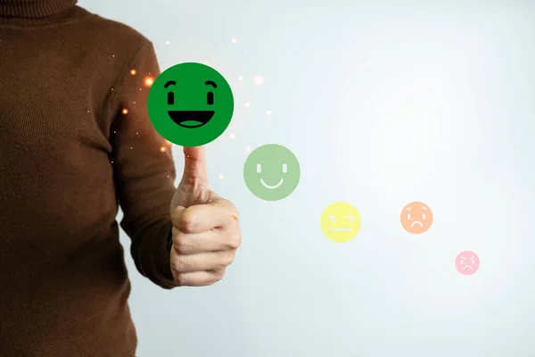 Customer satisfaction concept, client is satisfied with pressing the smiley face icon, excellent service, impressed with care, highest rating and score, good feedback from users.