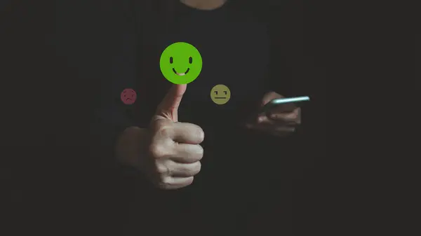 Customers evaluate satisfaction service by smartphone, caring and paying attention to service users, satisfy smile icon, giving the highest rating, very good response and feedback from customers.