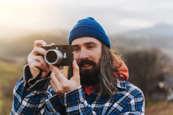 Attractive Man Long Hair Blue Beanie Backdrop Picturesque Hills Royalty Free Stock Images