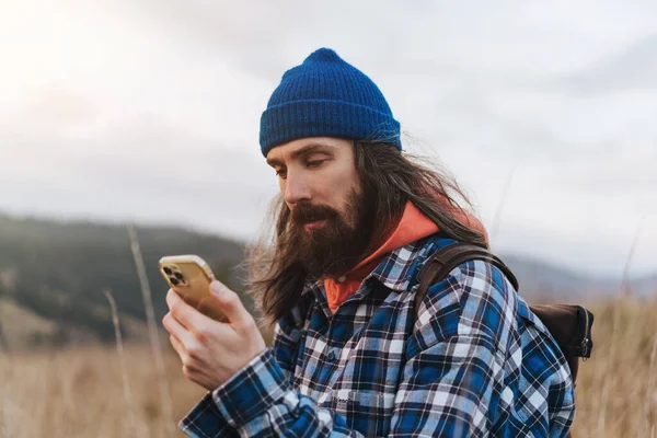 Portrait Bearded Male Travel Hikerin Blue Jacket Holding Smart Phone Royalty Free Stock Images