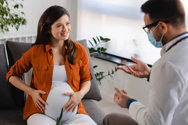 pregnant woman visiting doctor for check up