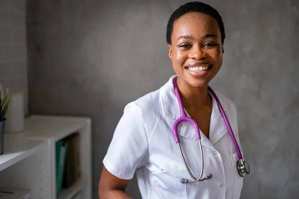 Stock image portrait of african american smiling doctor