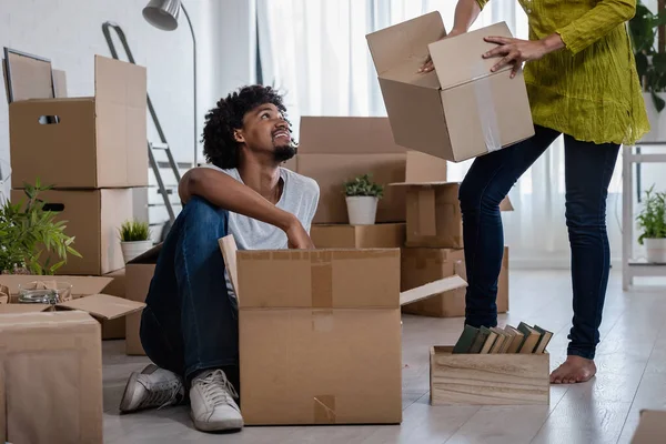 african american couple moving in new apartment