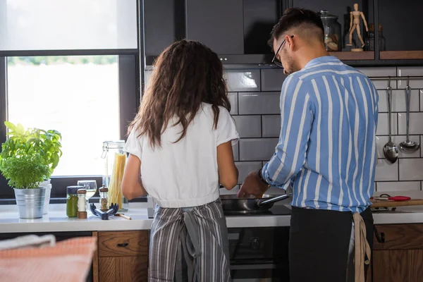 Happy Multiethnic Couple Cooking Homemade Tomatoes Basil Pasta Cooking Home — Stock Photo, Image