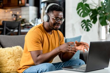 african american man working on laptop 