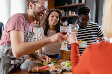 happy friends having dinner together