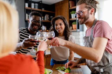 happy friends having dinner together