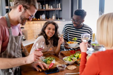 happy friends having dinner together