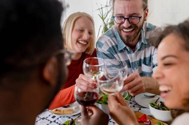 happy friends having dinner together