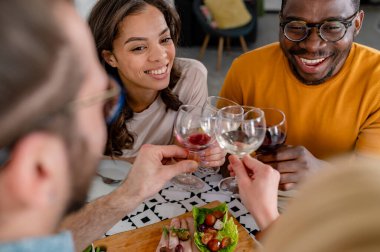 happy friends having dinner together