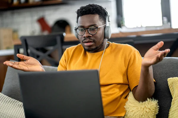 african american man working on laptop 