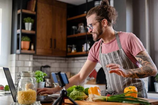 stock image handsome young man cooking