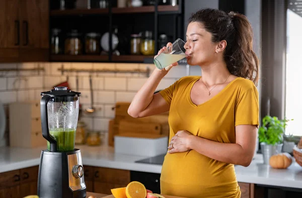 stock image pregnant woman cooking at kitchen, healthy eating concept