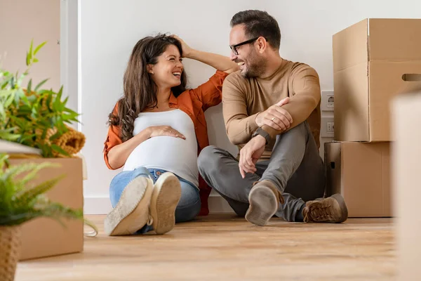 young couple, future parents in new flat
