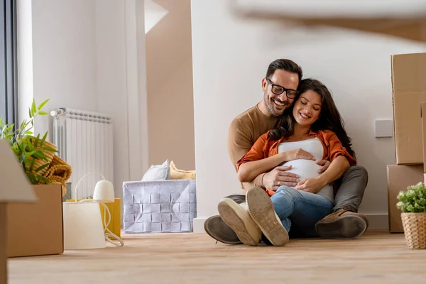 young couple, future parents in new flat