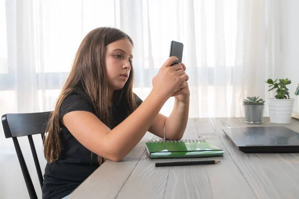 stock image little girl using smartphone at home