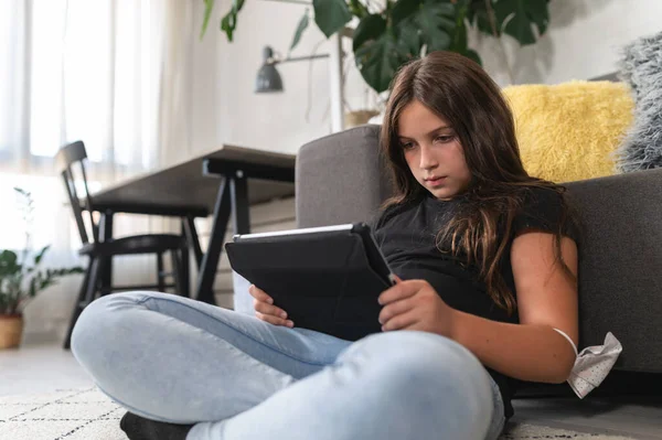 Stock image cute little girl using tablet