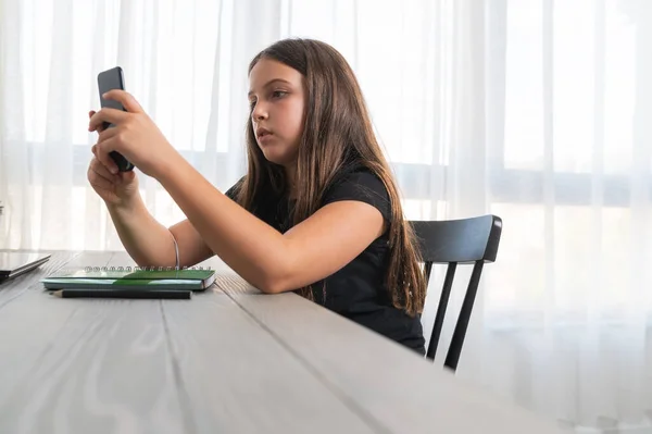 stock image little girl using smartphone at home