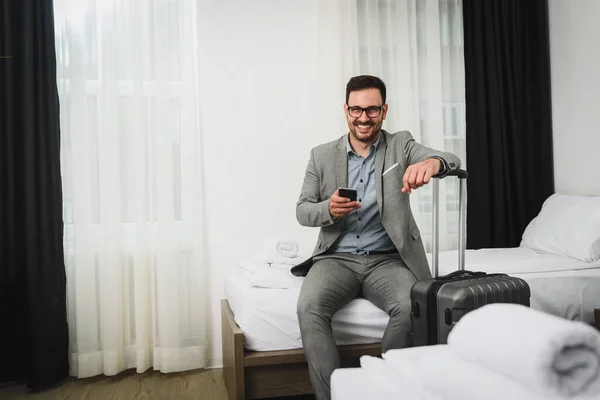 stock image man with luggage waiting for business trip