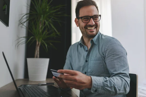 stock image young handsome man making online order 