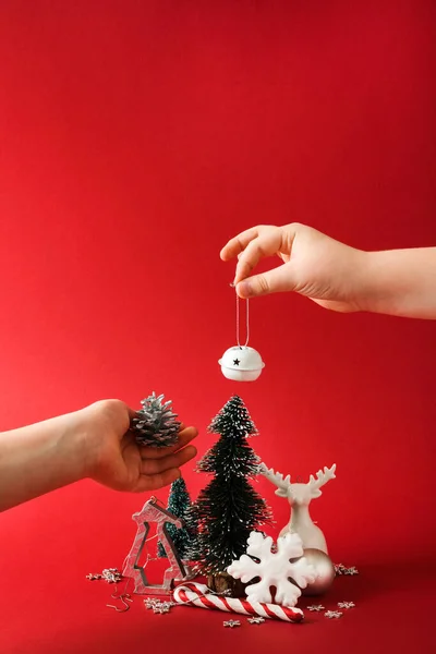 Small Christmas tree decoration in hands