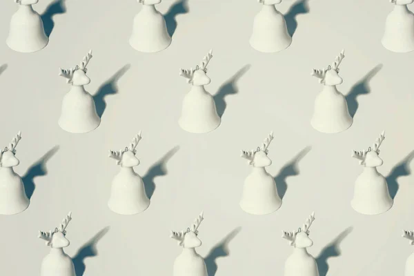 stock image Abstract conceptual winter holiday background with tiled reindeer bell ornament