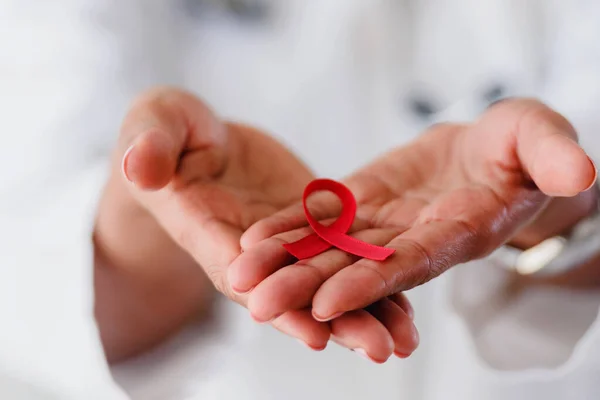 Red Ribbon Aids Awareness Doctors Hands — Stock Photo, Image