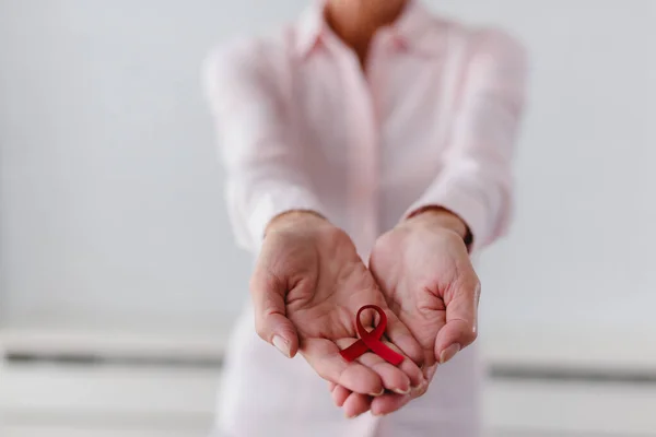 Red Ribbon Aids Awareness Womans Hands — Stock Photo, Image