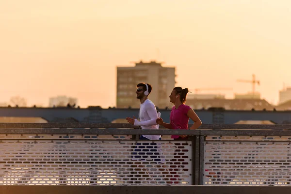 stock image sporty couple training on the bridge