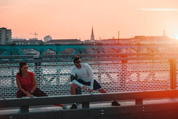 stock image sporty couple training on the bridge