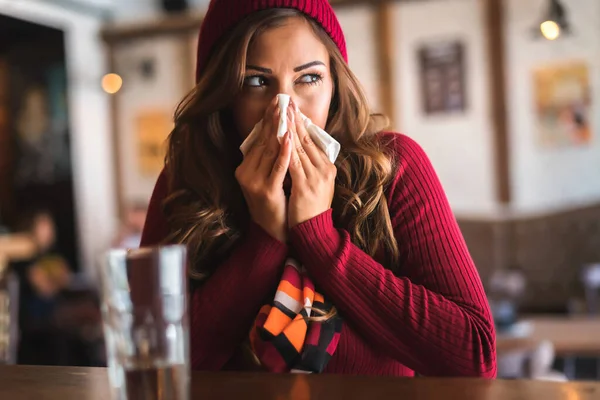 young woman with a handkerchief, sickness concept