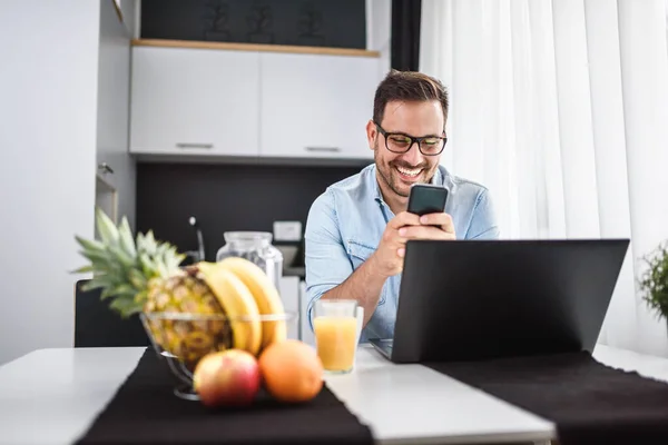 stock image young man working at home 