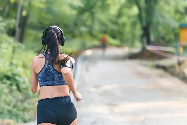 stock image young woman running outdoors