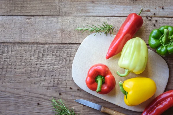 stock image fresh bell peppers on wooden background