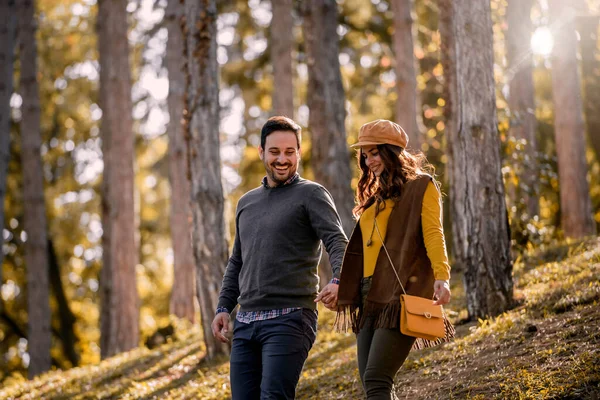 stock image young couple in love walking in park