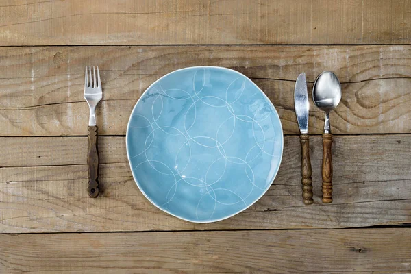 Blue Plate Knife Fork Rustic Wooden Table Dining Background — Stock Photo, Image