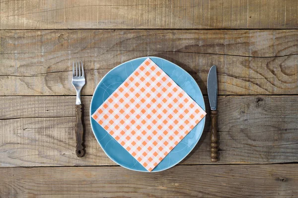 Blue Plate Knife Fork Rustic Wooden Table Dining Background — Stock Photo, Image
