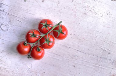 fresh ripe tomatoes on a wooden background. top view.