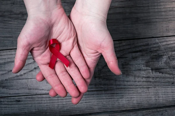 Red Ribbon Palms Awareness Support People Living Hiv — Stock Photo, Image