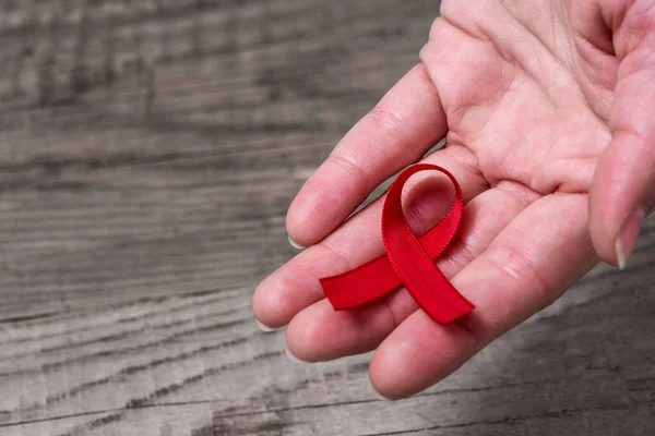 Red Ribbon Hand Awareness Support People Living Hiv — Stock Photo, Image